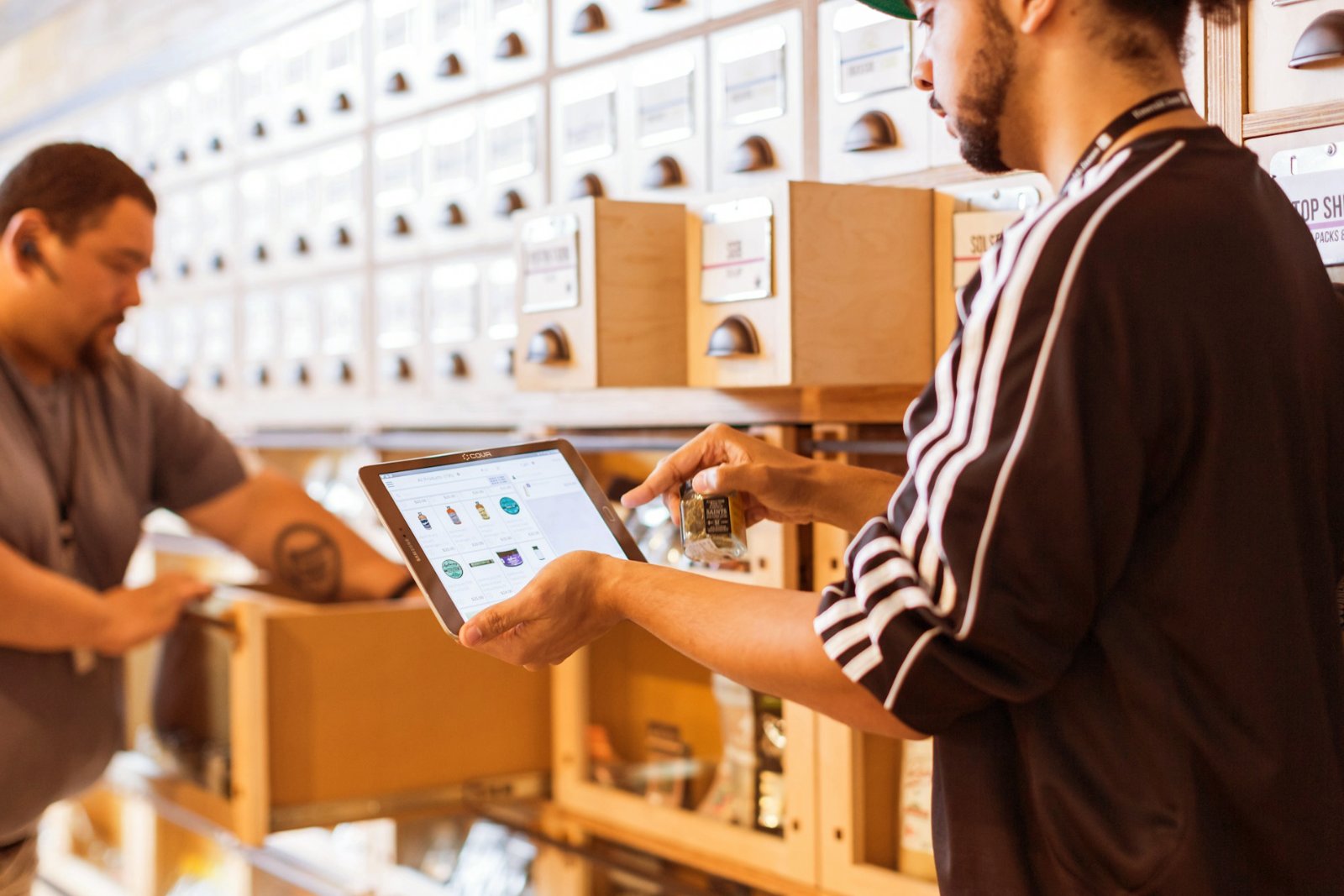 Store staff checking stock on a tablet