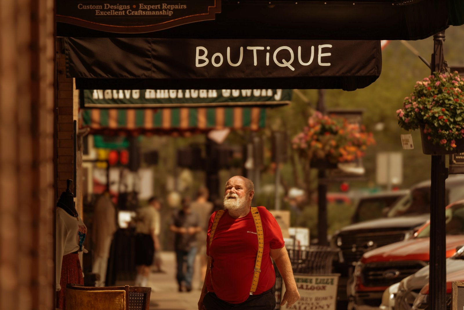 Man walking past a boutique storefront