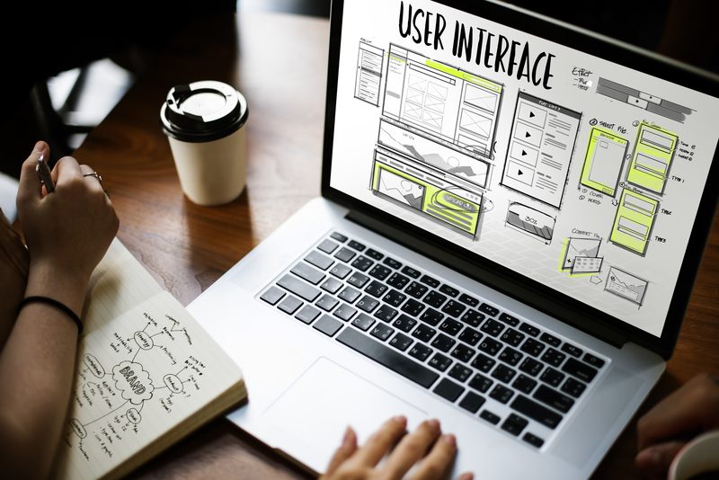 Website user interface displayed on a laptop