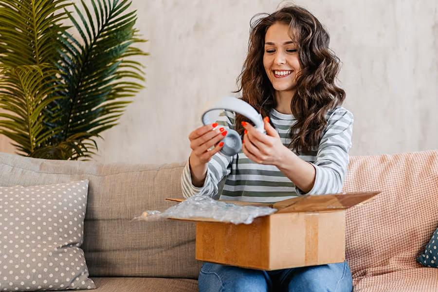 Customer unboxing a home delivery parcel