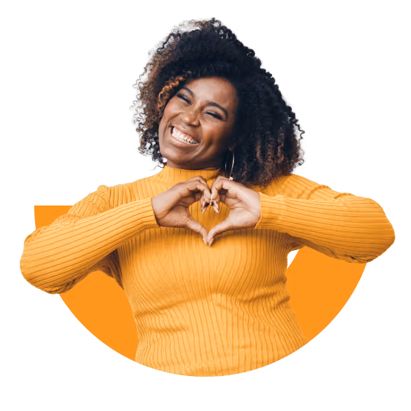 Smiling woman making a heart shape with her hands