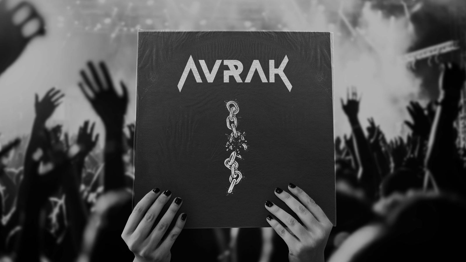 AVRAK vinyl held up in front of a crowd