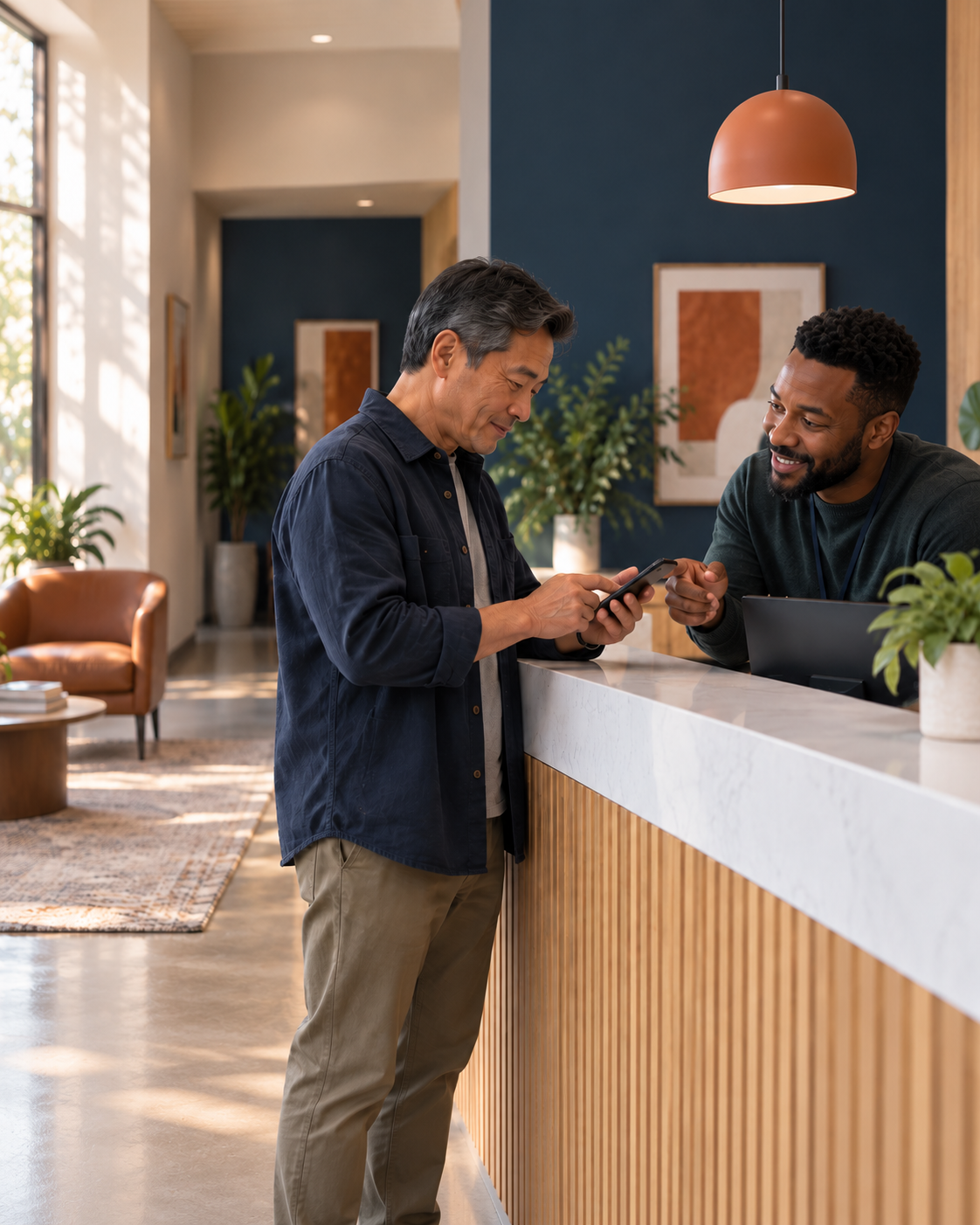Front desk team member confirming a patient's coverage at check-in