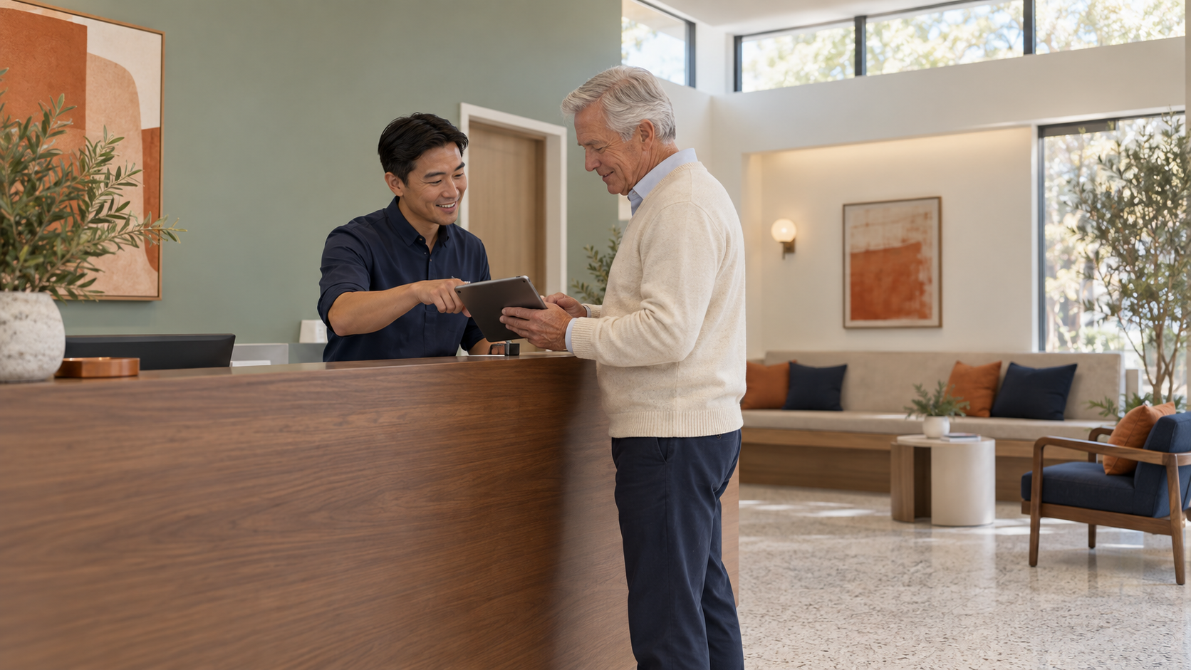 Front desk team member checking a patient in