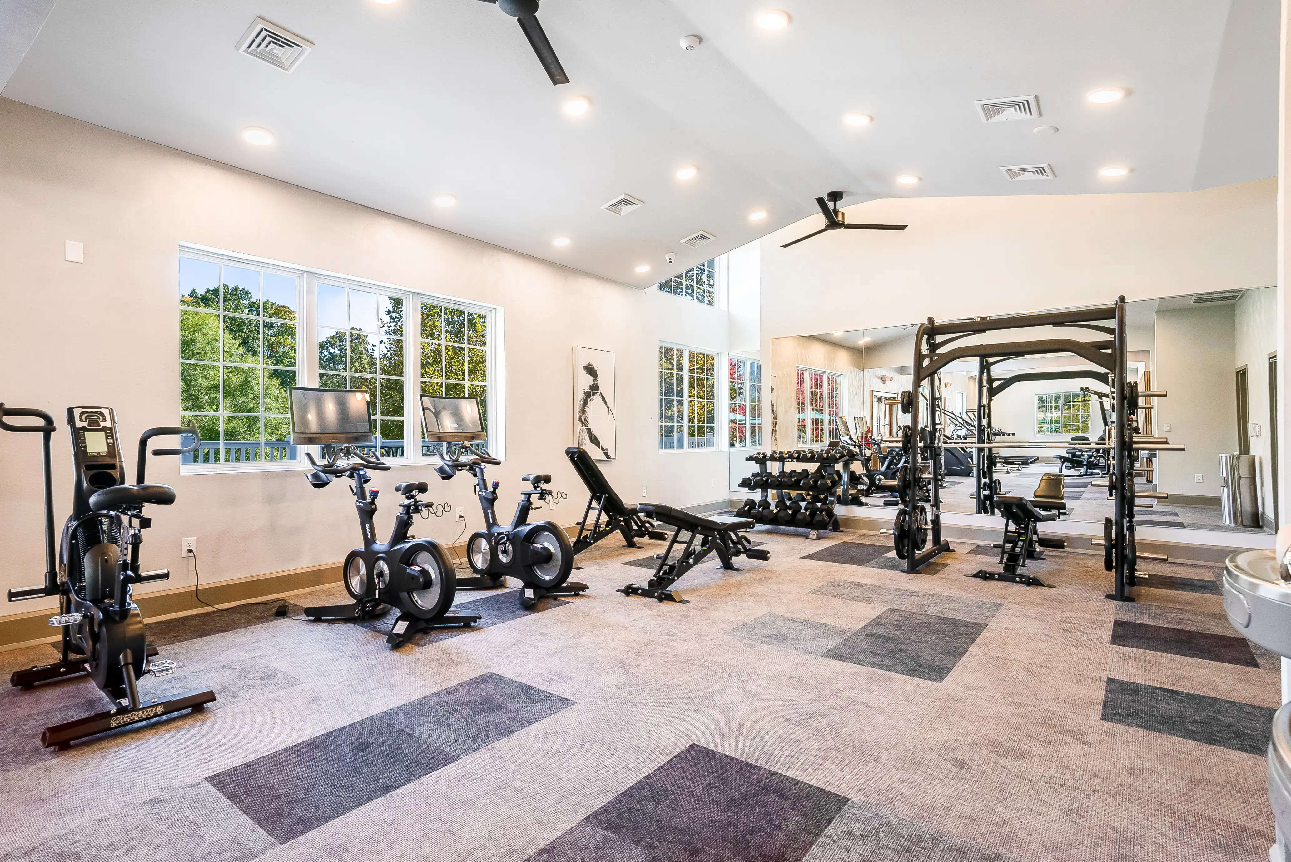24-hour fitness center with bikes and squat racks at The Hills Southview