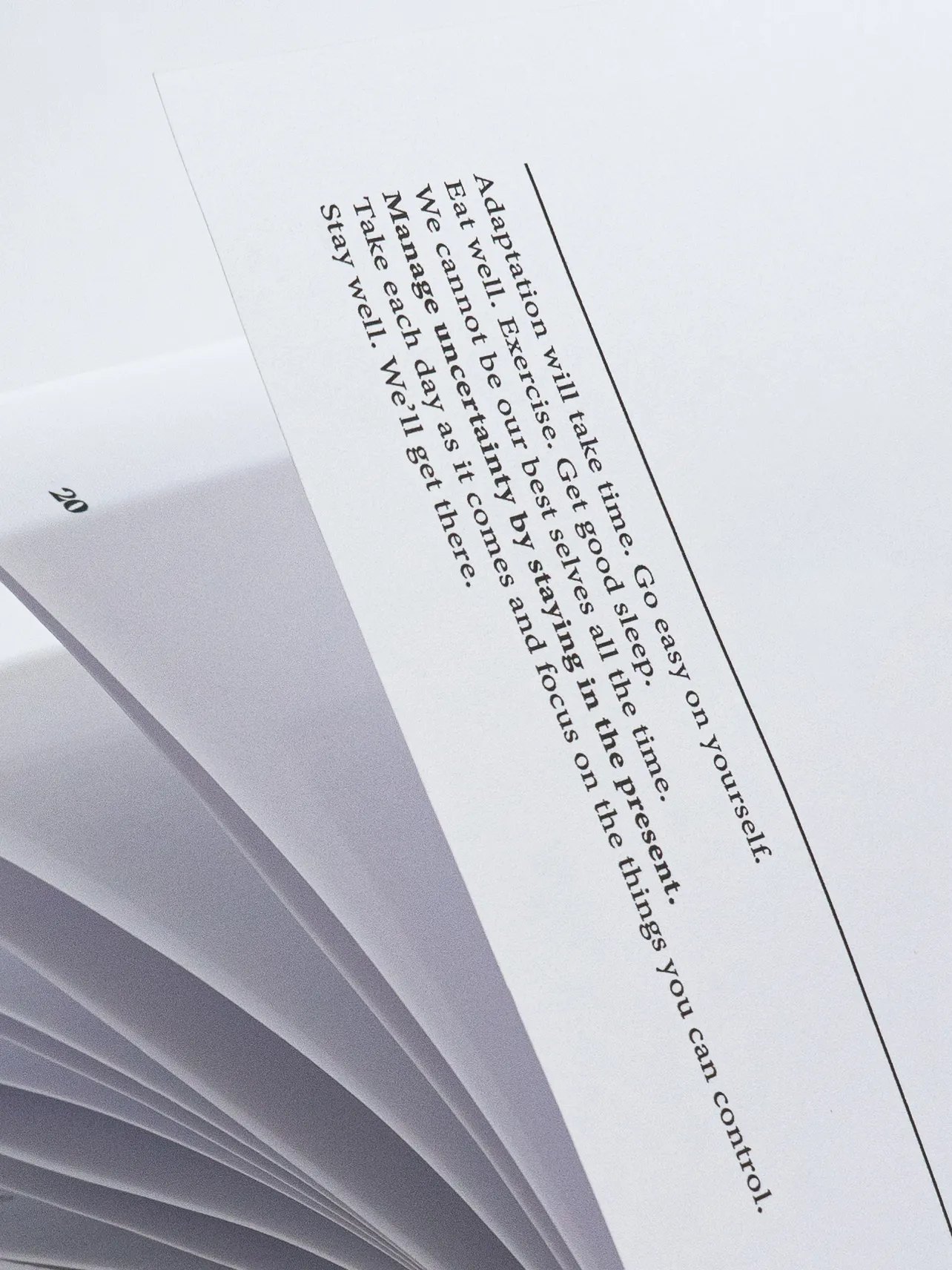 Pages fanned open with a printed passage