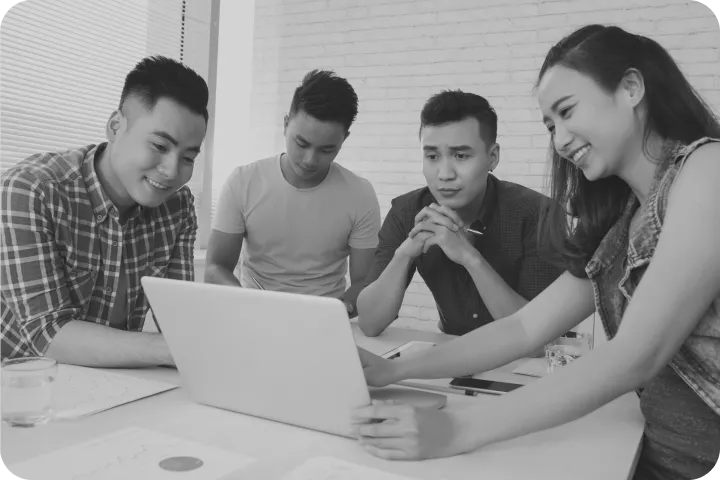 Colleagues reviewing a laptop together