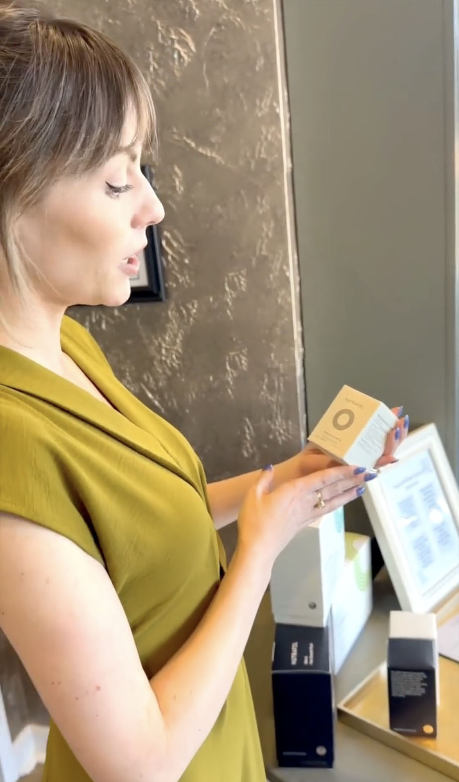 Provider showing skincare products to a guest