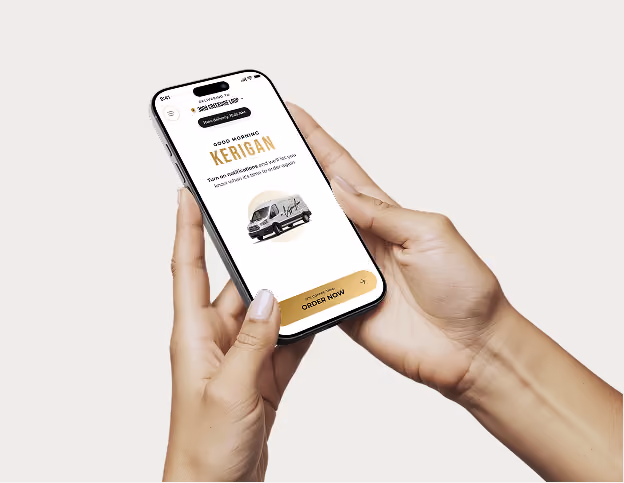 A woman using the CoffeeNow app on her mobile phone