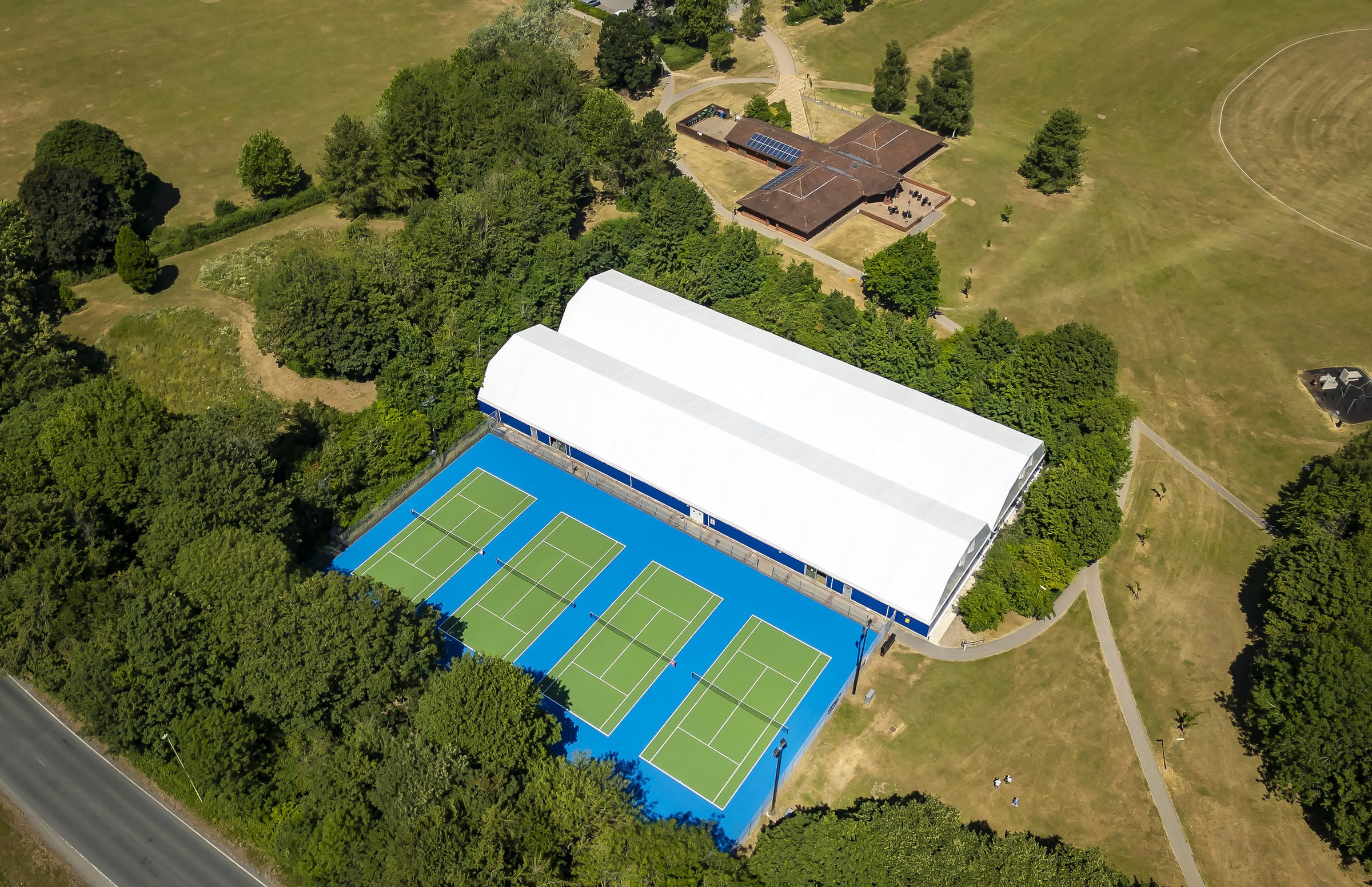 Aerial view of the outdoor tennis courts and the Basingstoke Indoor Tennis Centre in War Memorial Park