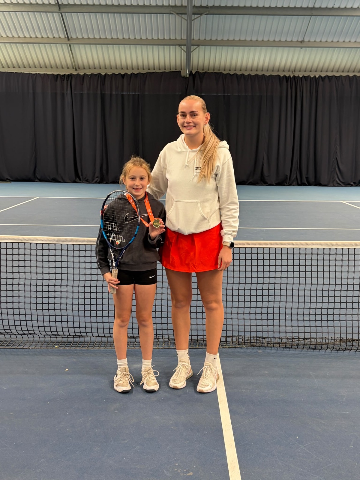 Elaina with her coach, Isla