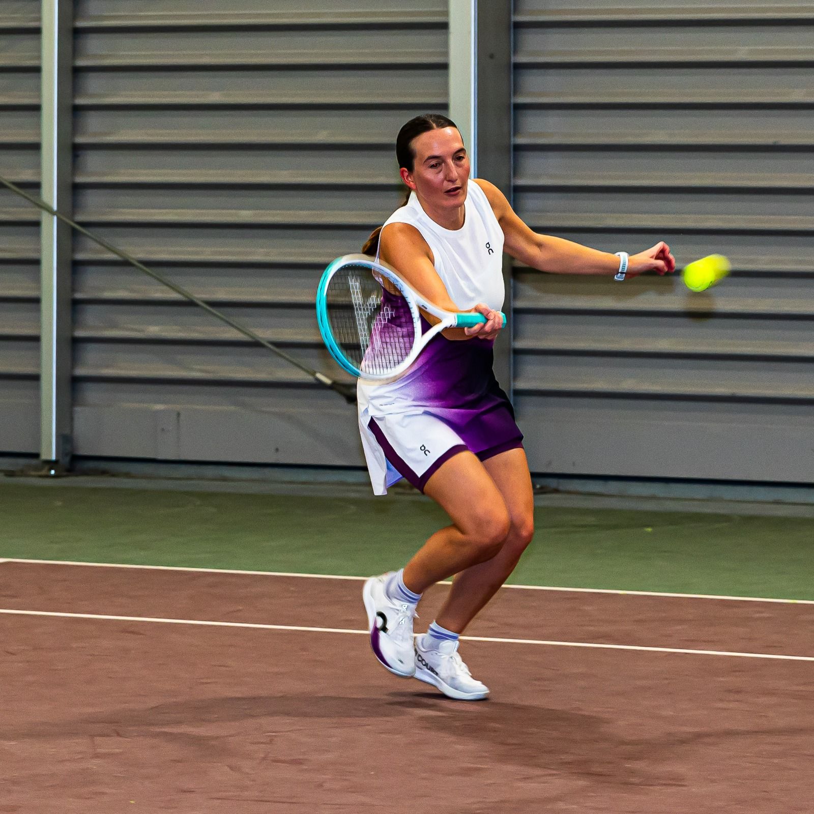 Doubles players in action on the indoor courts