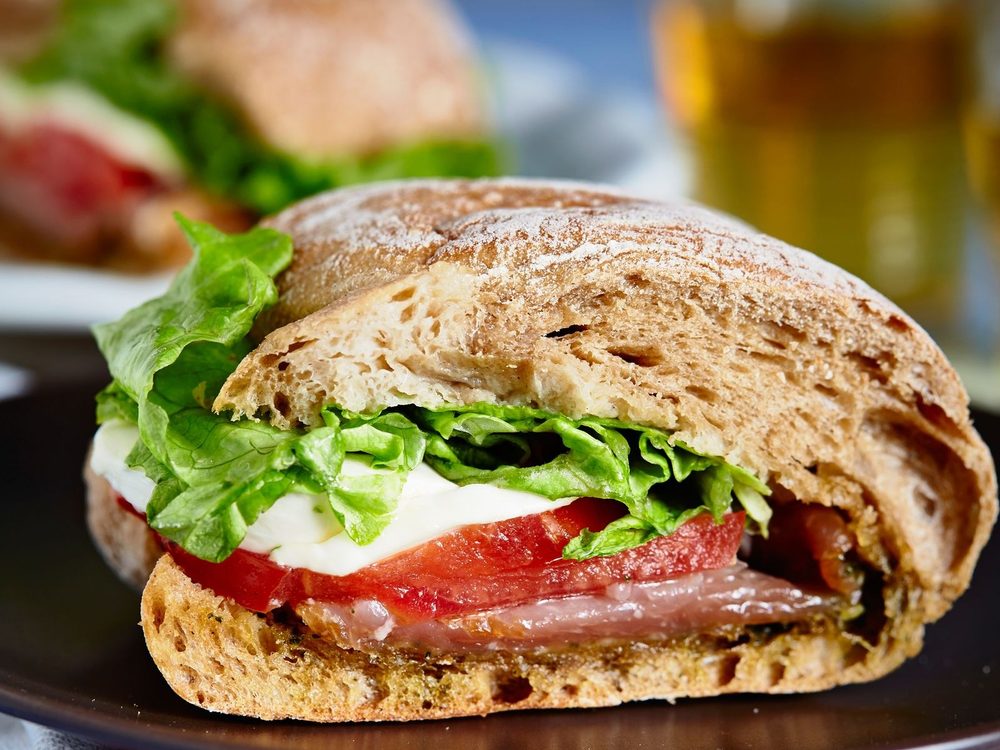 Toasted ciabatta filled with mozzarella, tomato and salad