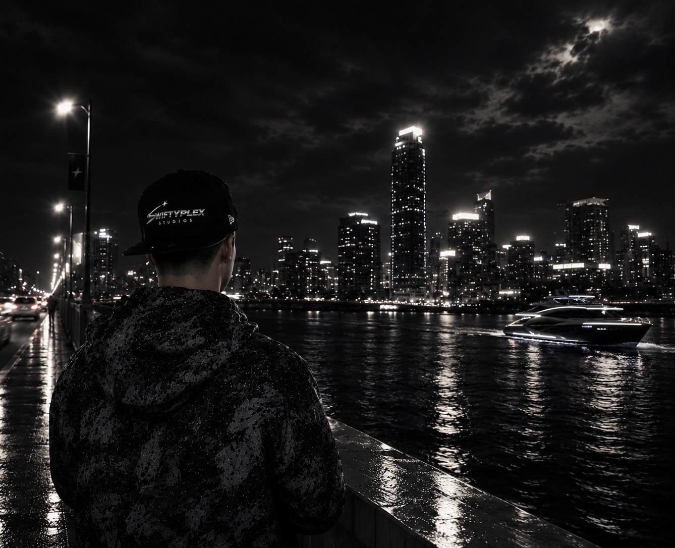 Isaiah Stang, Founder / CEO of SwiftyPlex Studios, overlooking a city skyline at night