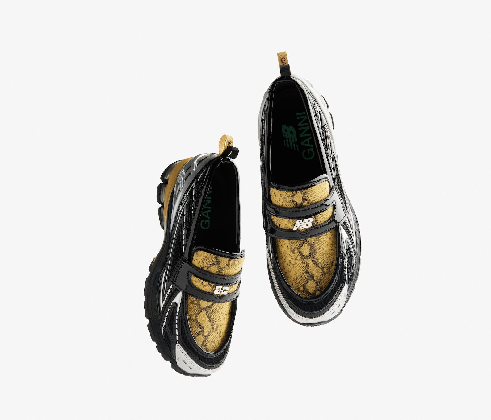 New Balance 1906L x Ganni loafer–sneaker hybrid in black and yellow snakeskin gloss, photographed from above, 2025 release