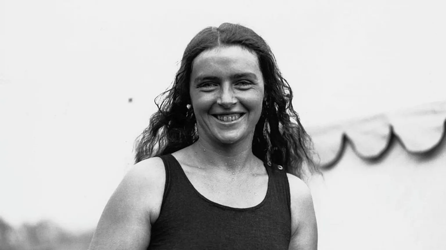 Mercedes Gleitze, british swimmer poses for a photograph in swimwear, smiling. 