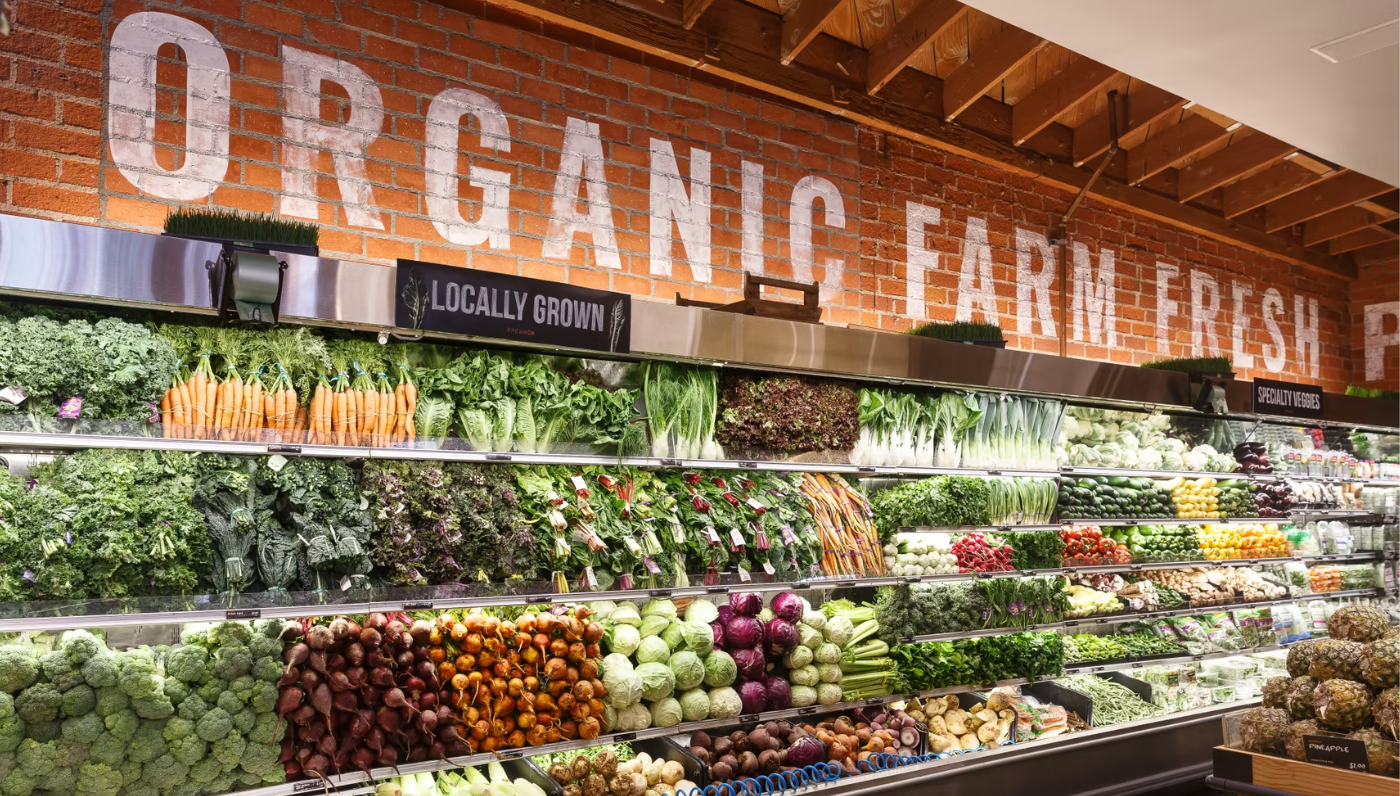a view of a fully stocked organic vegetables display at Erewhon supermarket