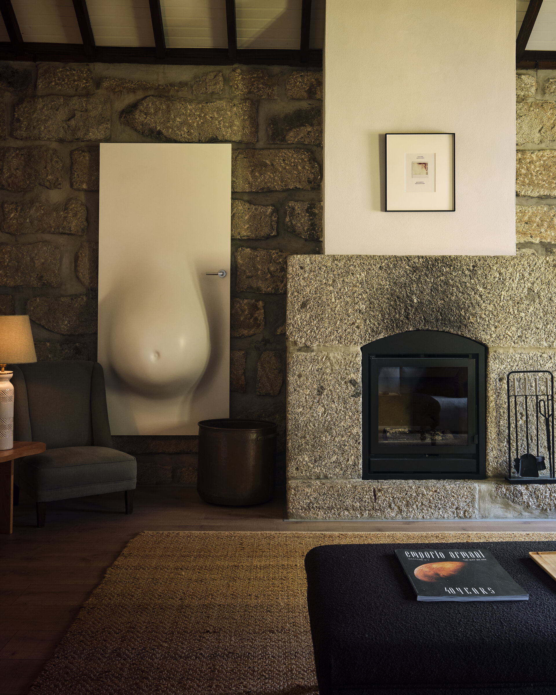 Living room with granite fireplace at Paço da Glória