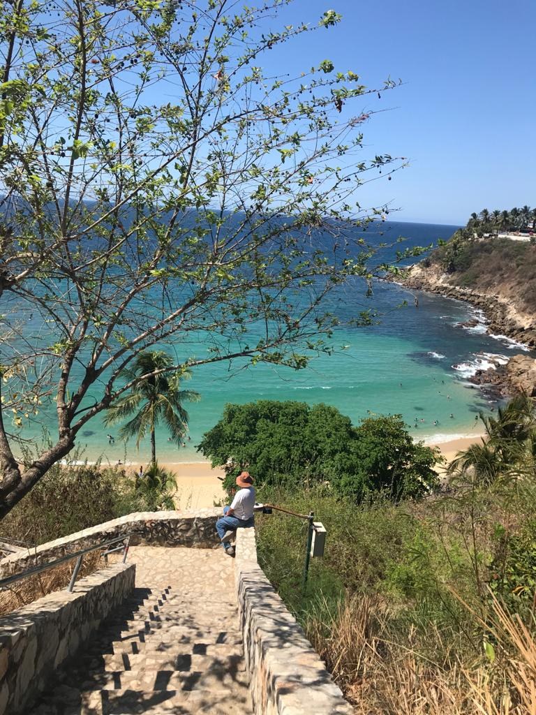 Illustrative regional photograph of the Puerto Escondido coast; not the advertised demo property