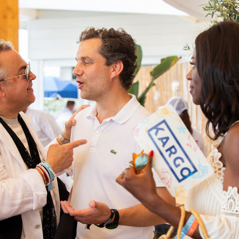 Kargo's CEO, Harry Kargman, interacting with guests holding branded materials