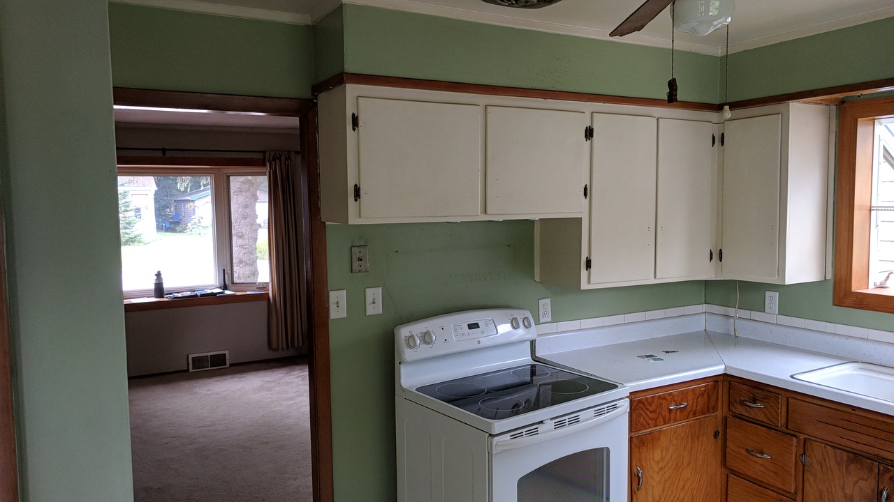 Oconomowoc kitchen before renovation, showing the original finishes and condition.