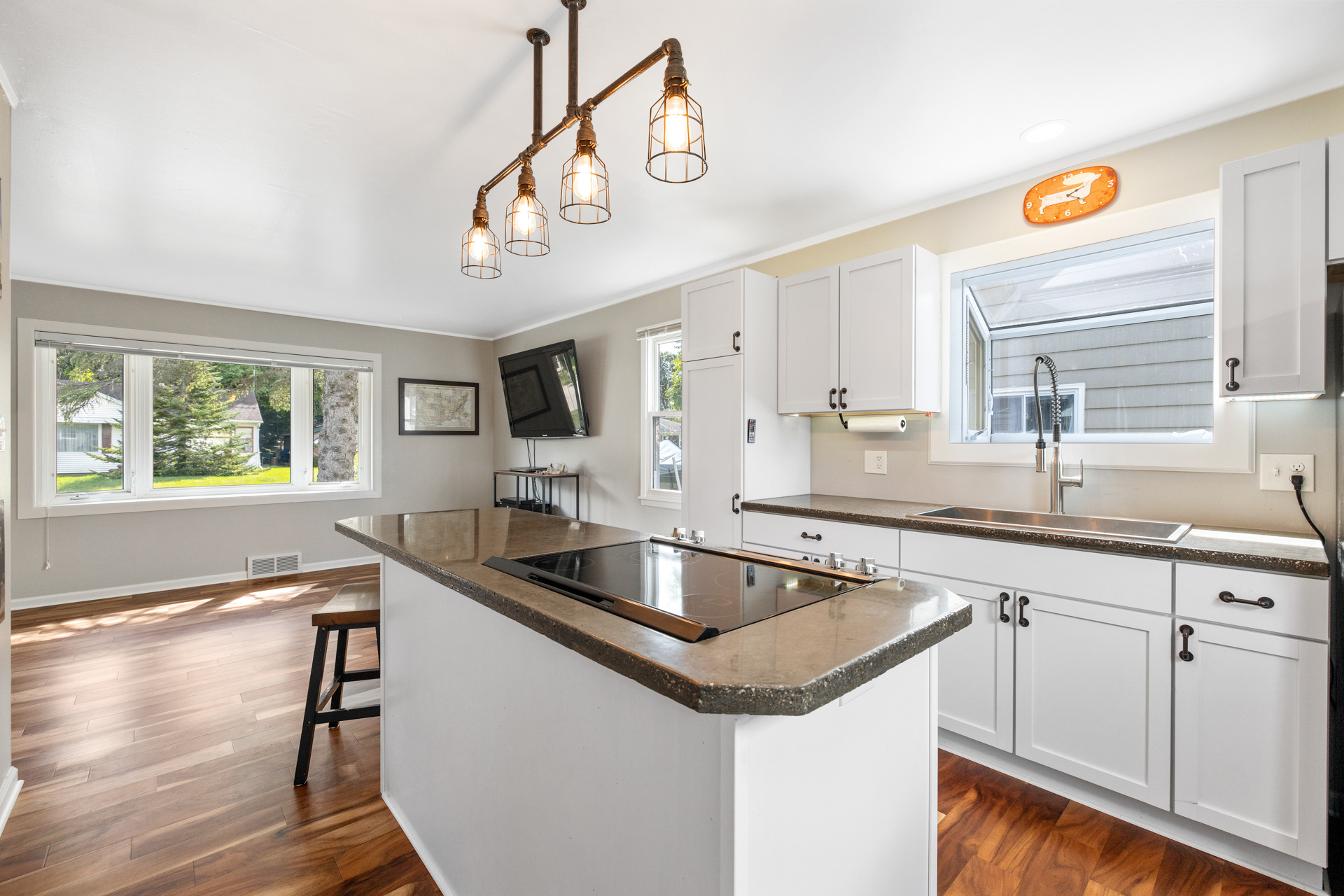 Finished Oconomowoc kitchen after the whole-house renovation, with cabinetry, counters and flooring