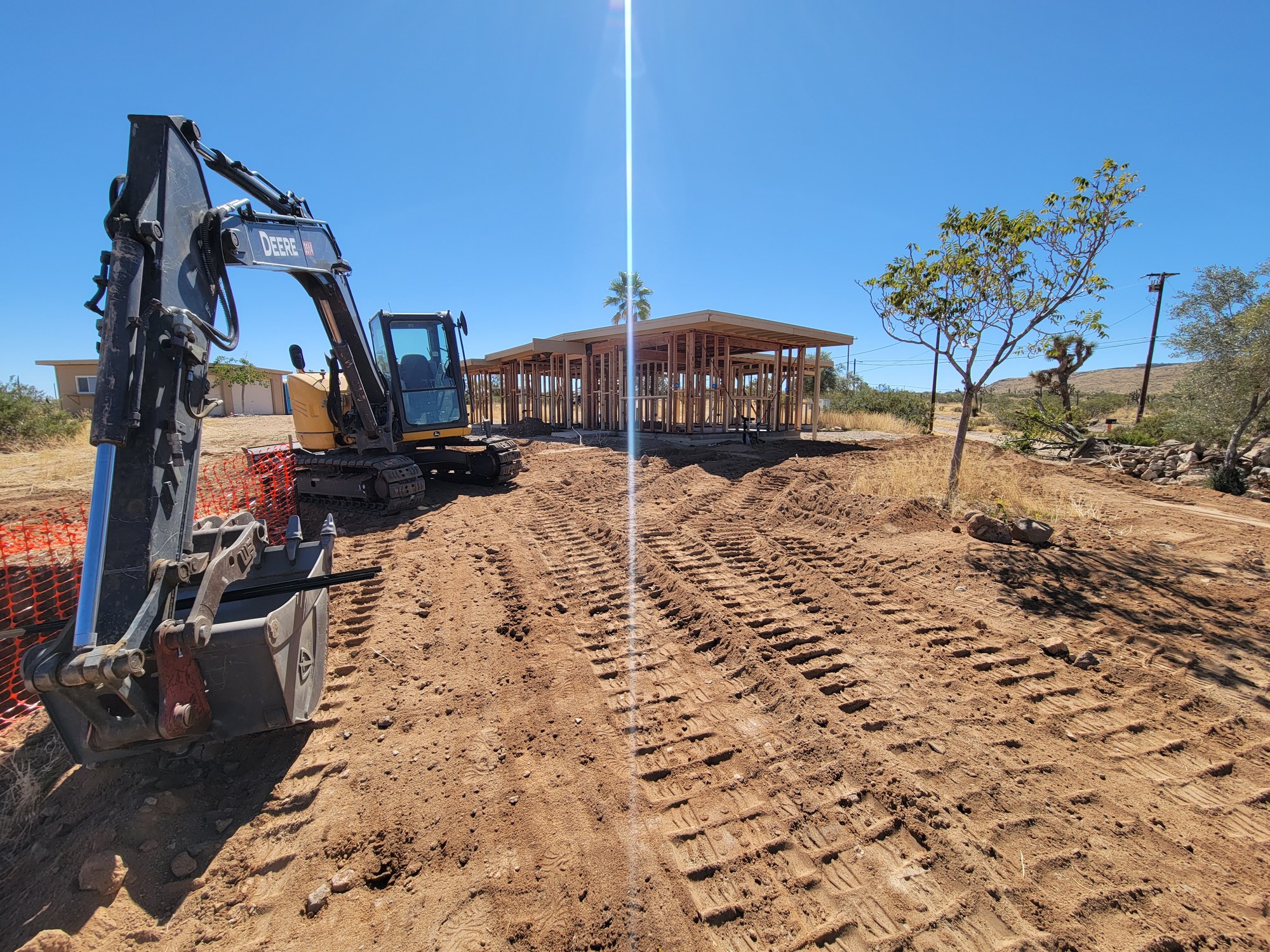 Excavator working on residential septic-system excavation in Yucca Valley.