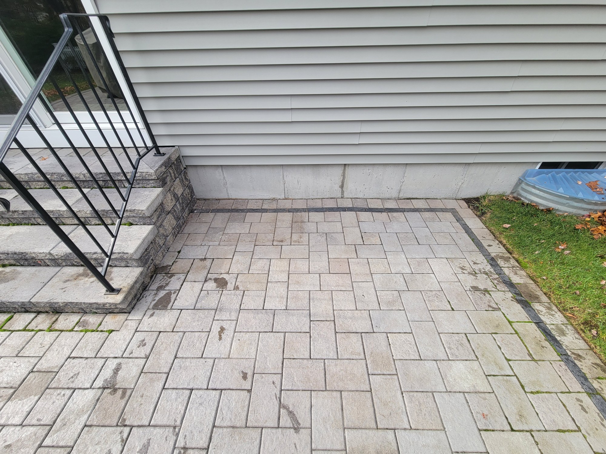 Patio pavers beside the Greenville foundation, where exterior grading was corrected