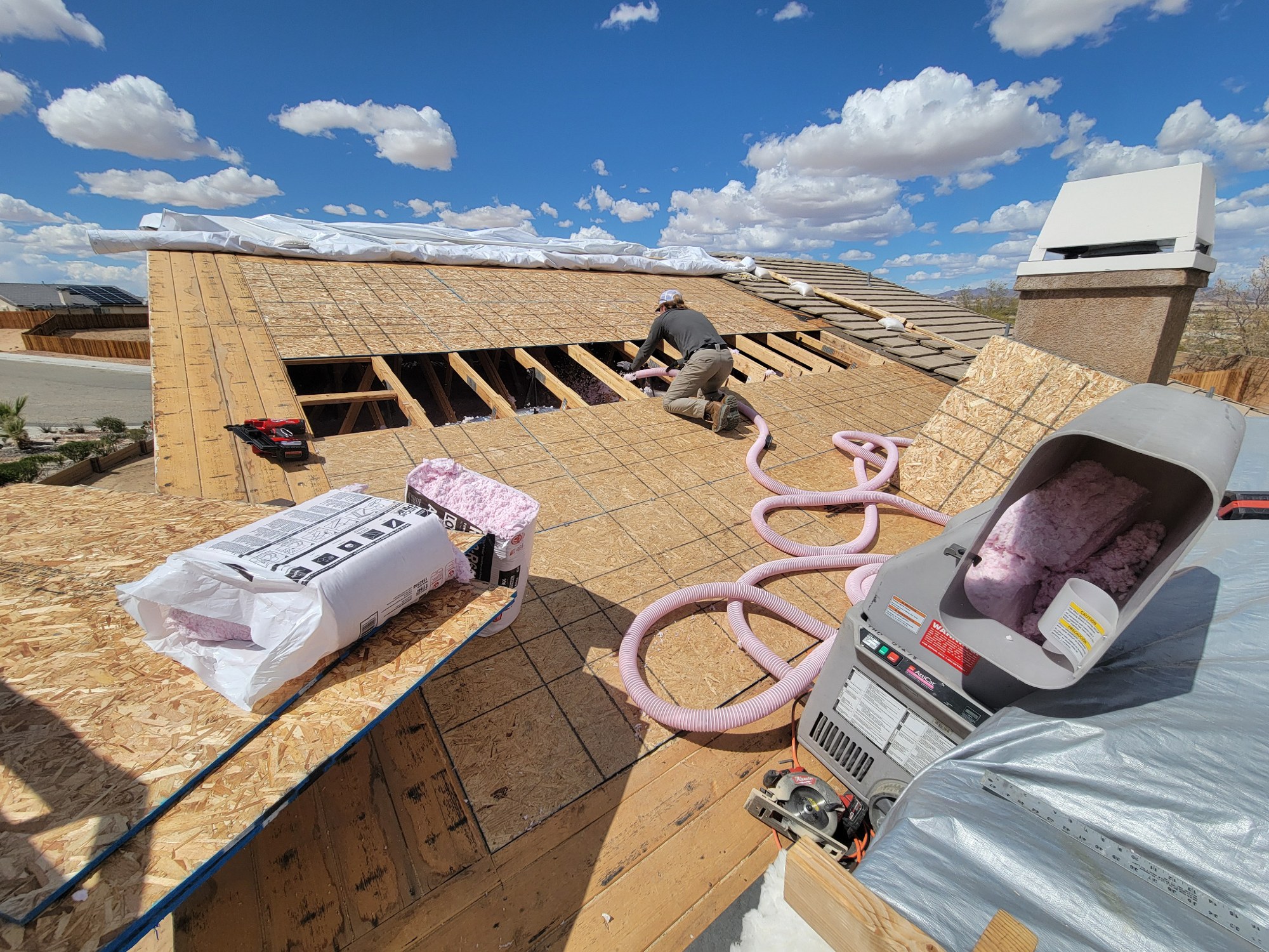 Roof repair area during insulation and sheathing replacement work.