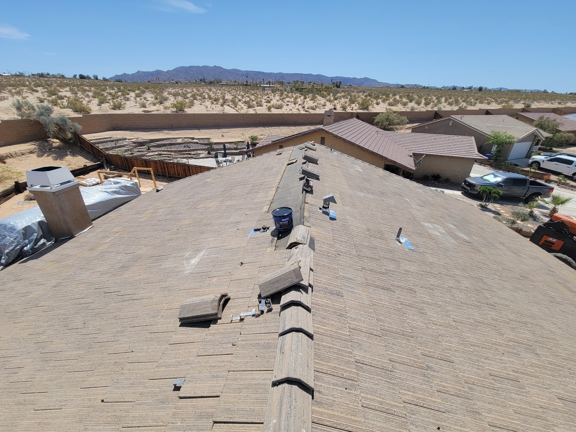Residential tile roof substantially restored after structural truss repair.