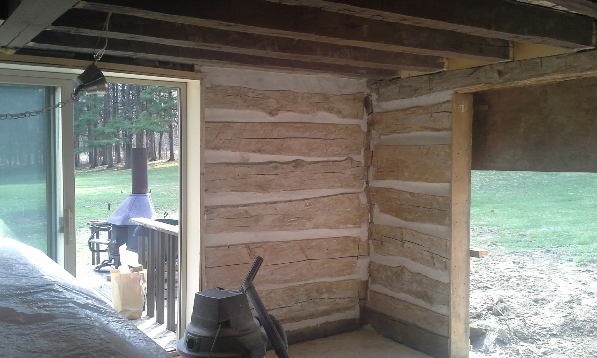 Re-chinked log corner with the room still open to ongoing construction.