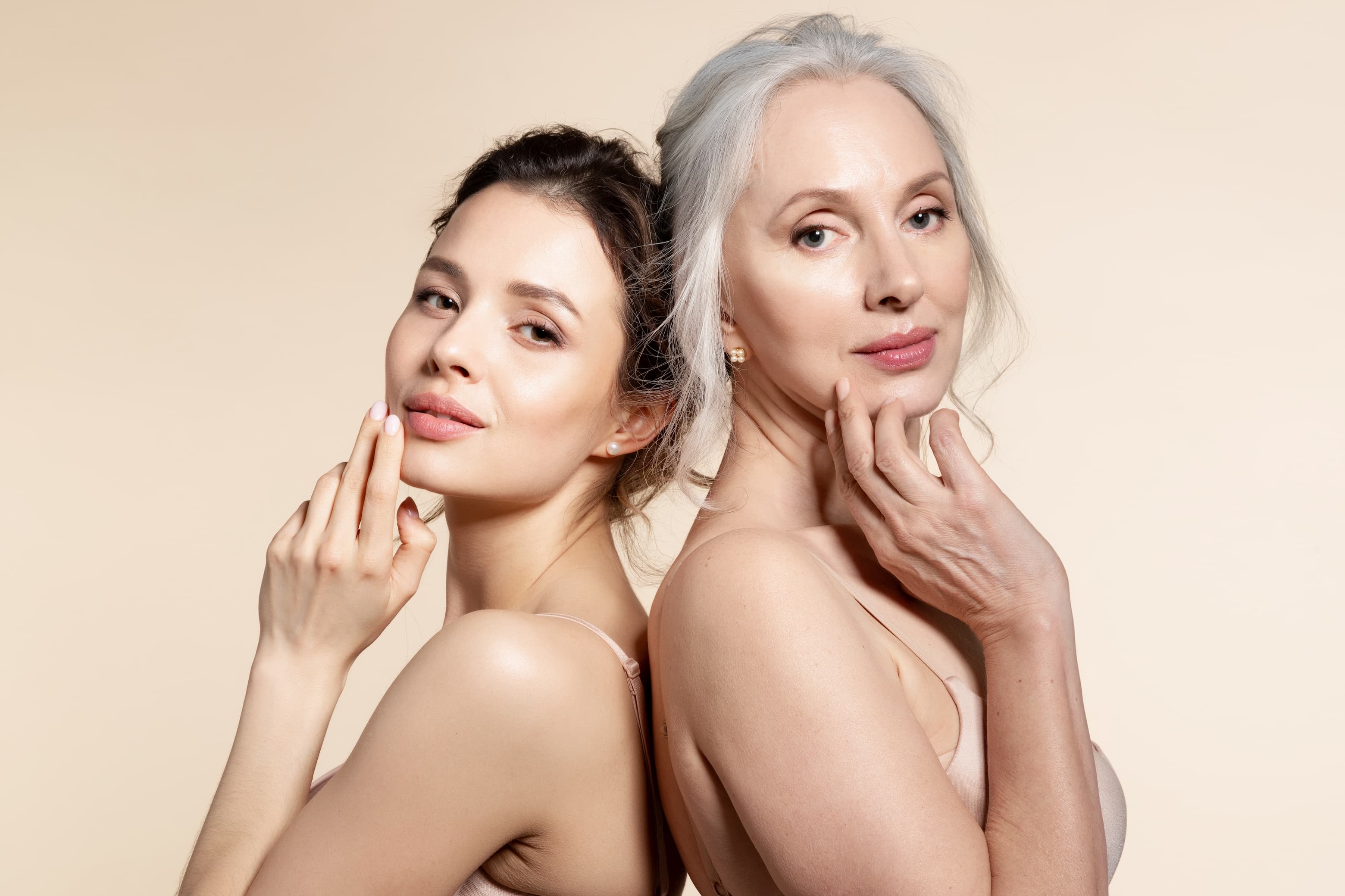 two women touching their face
