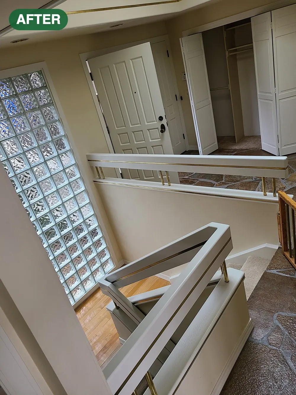 Stairway and railing freshly painted in a light color after an interior project