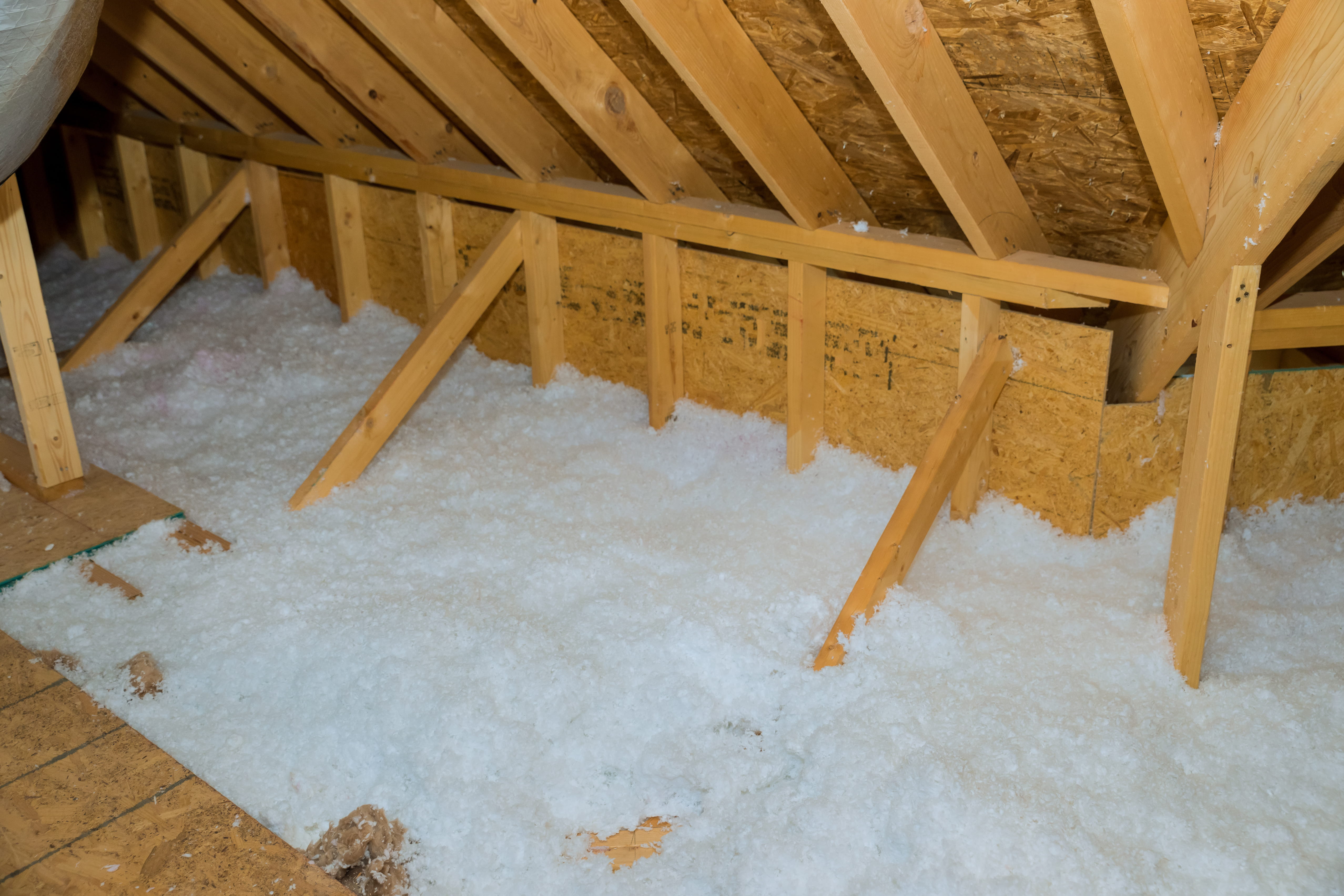 Blown-in fiberglass attic insulation