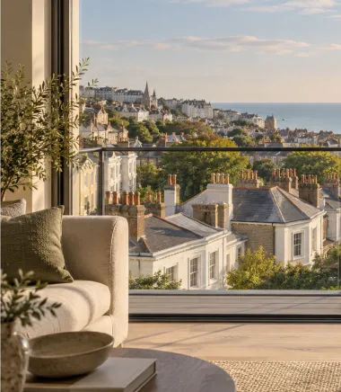 Living room with views across Hove rooftops to the sea