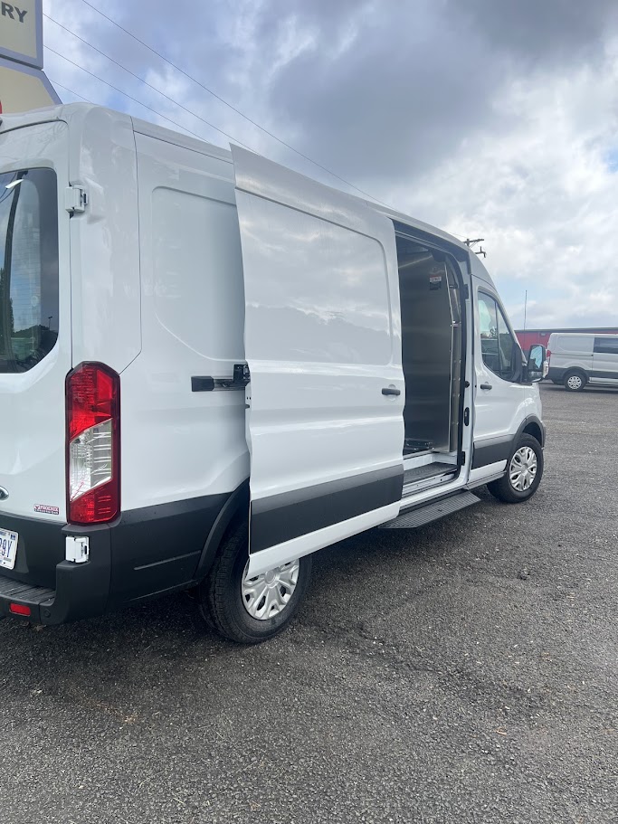 White cargo van with side door open, ready for commercial upfitting