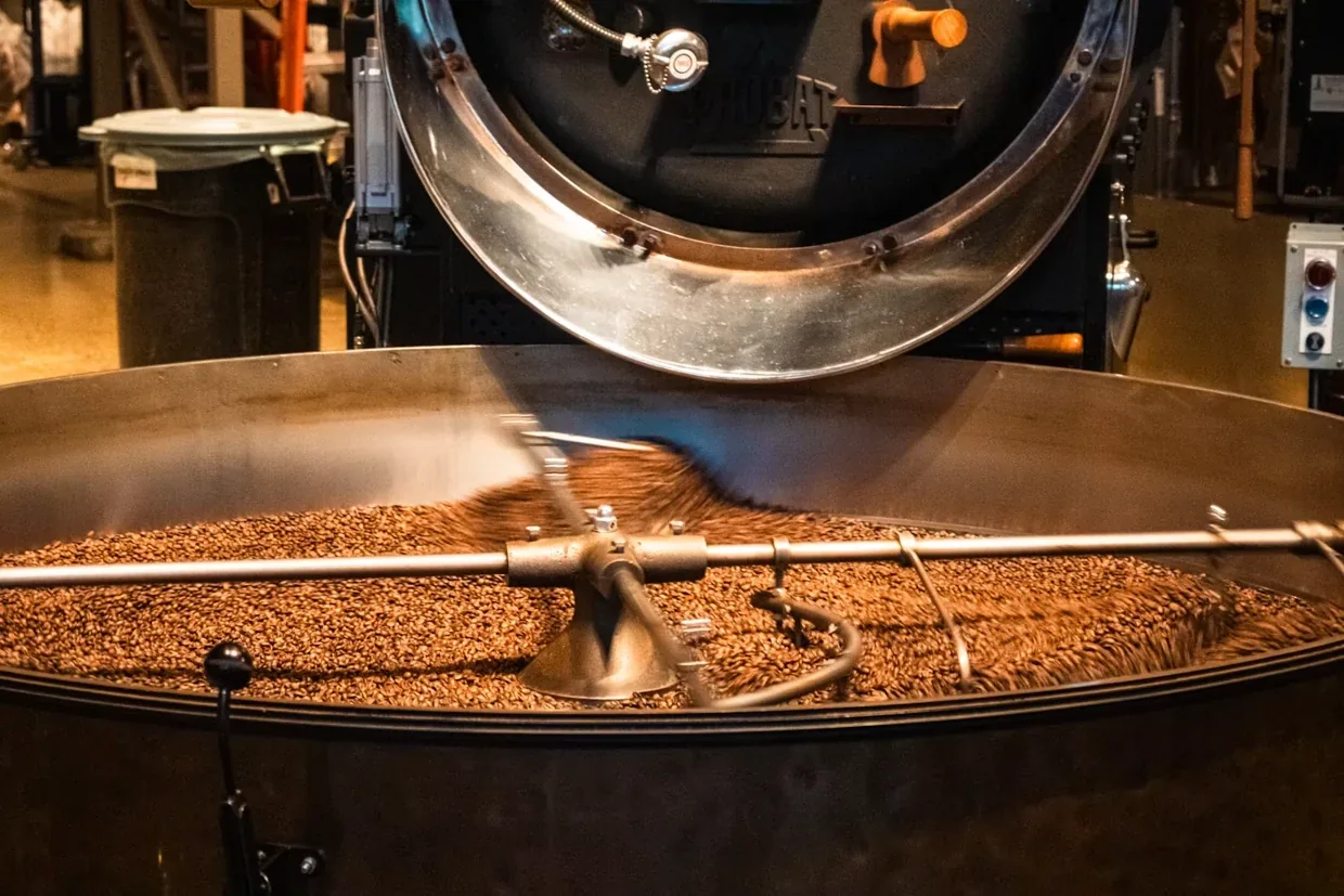 Freshly roasted coffee moving into the cooling tray