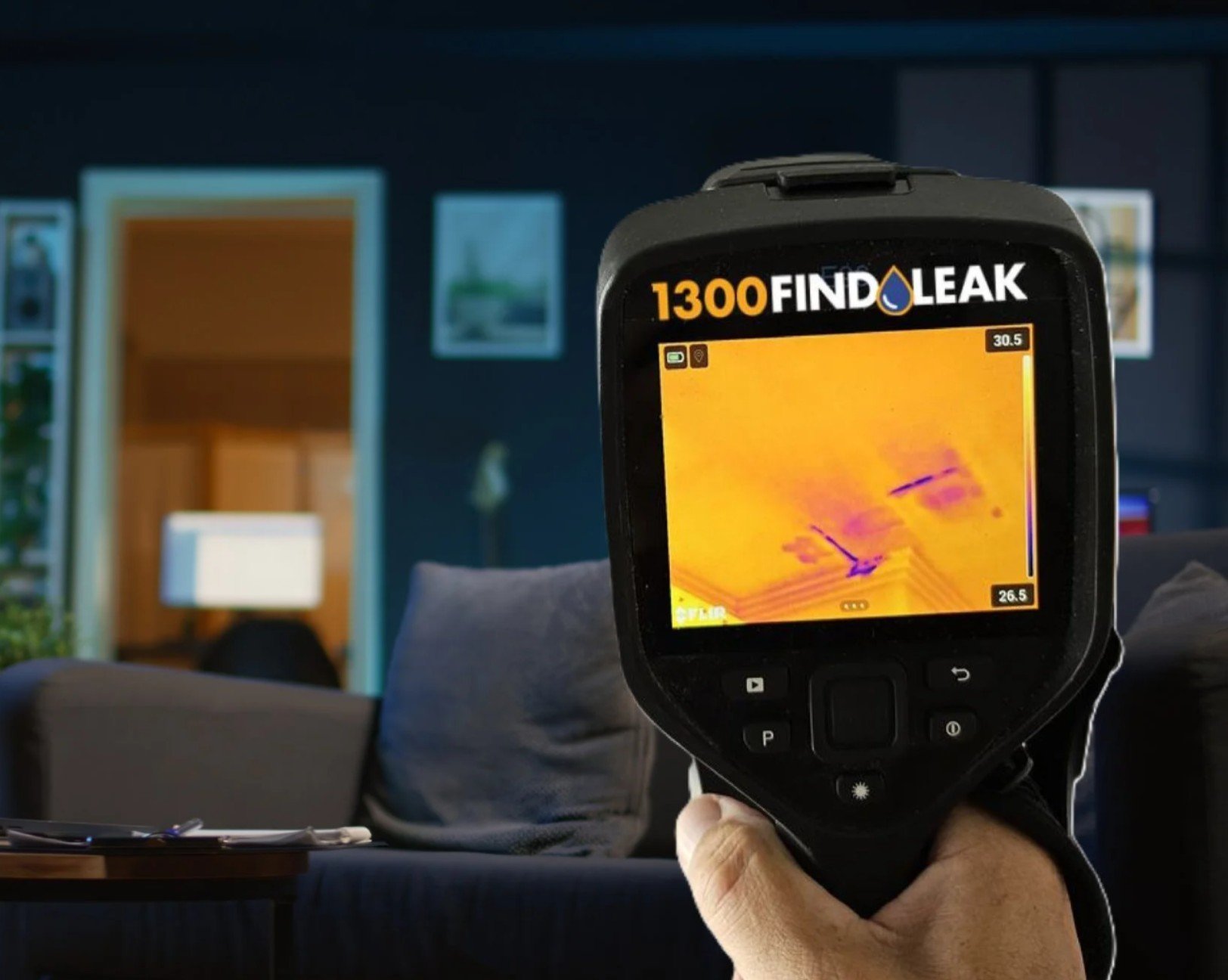 1300 FINDLEAK technician finding a hidden water leak with a thermal camera in Dubai