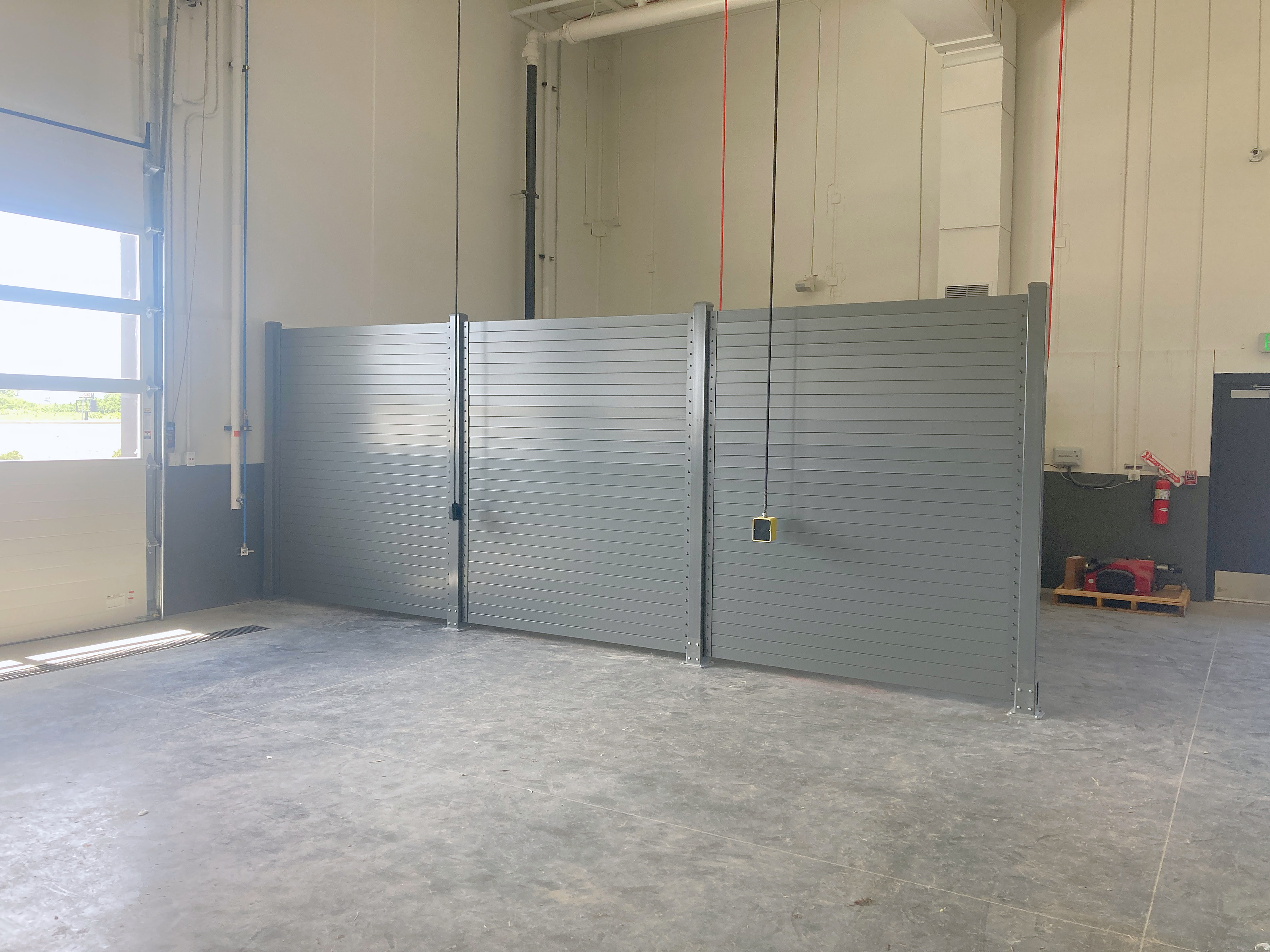 Structural steel screen wall around equipment, grey powder coat