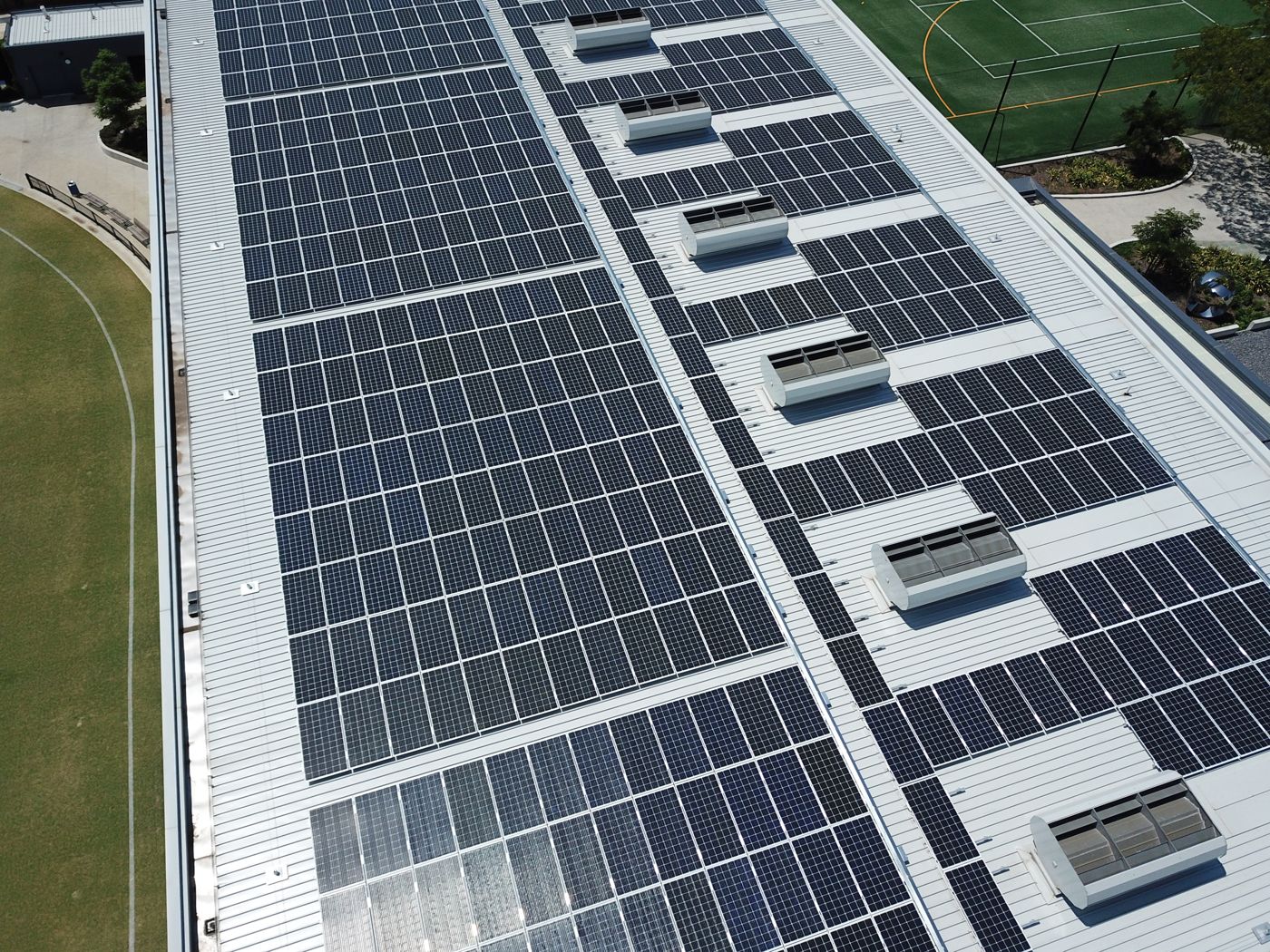 Aerial view of a large rooftop solar installation