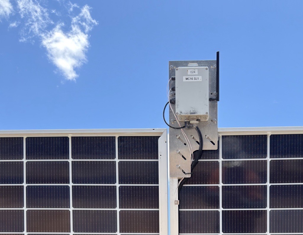 PulseBee wireless sensor node with antenna mounted on a bracket between solar panels