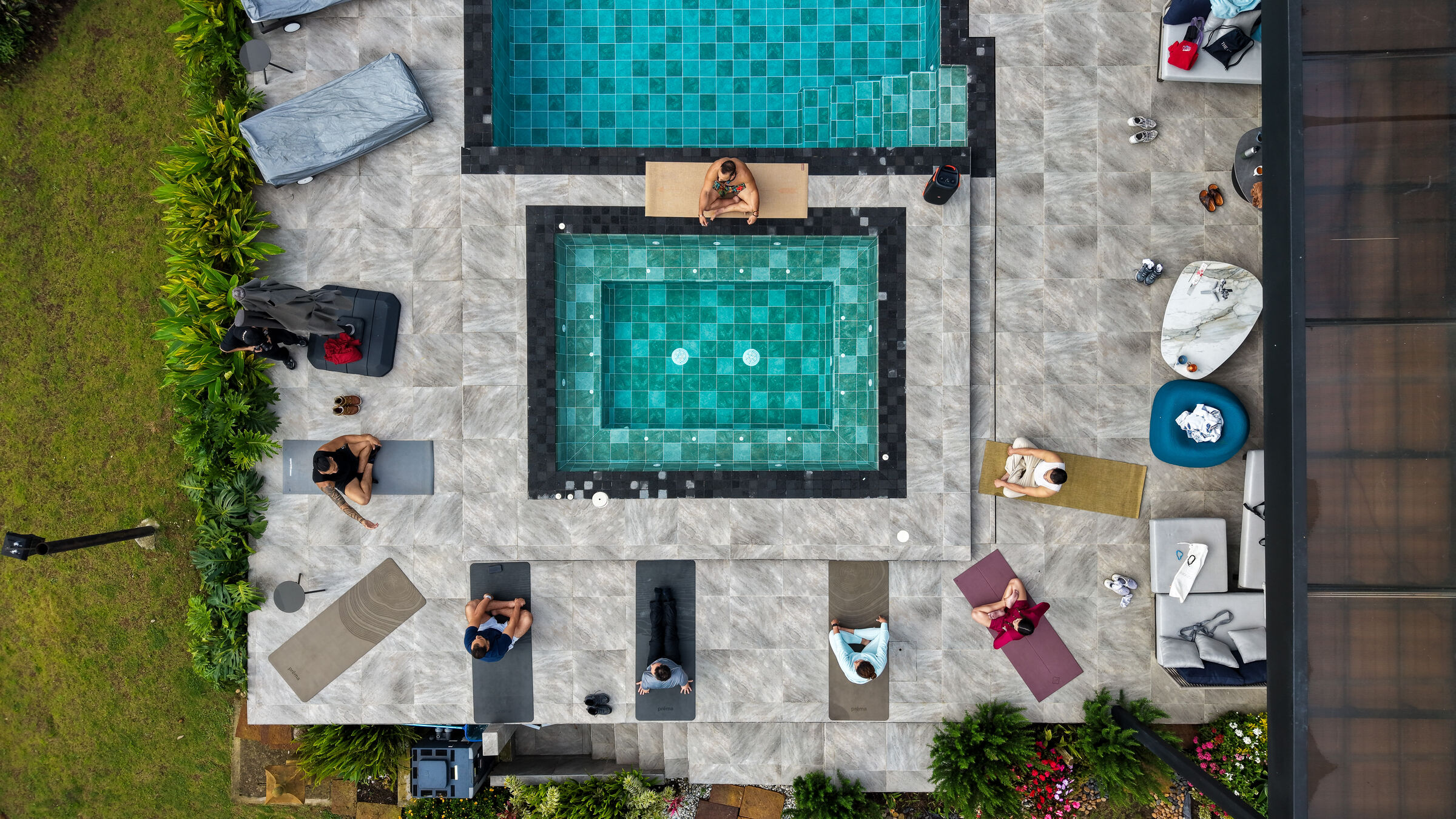 Top-down view of Founders Reset attendees lying on mats for breathwork.