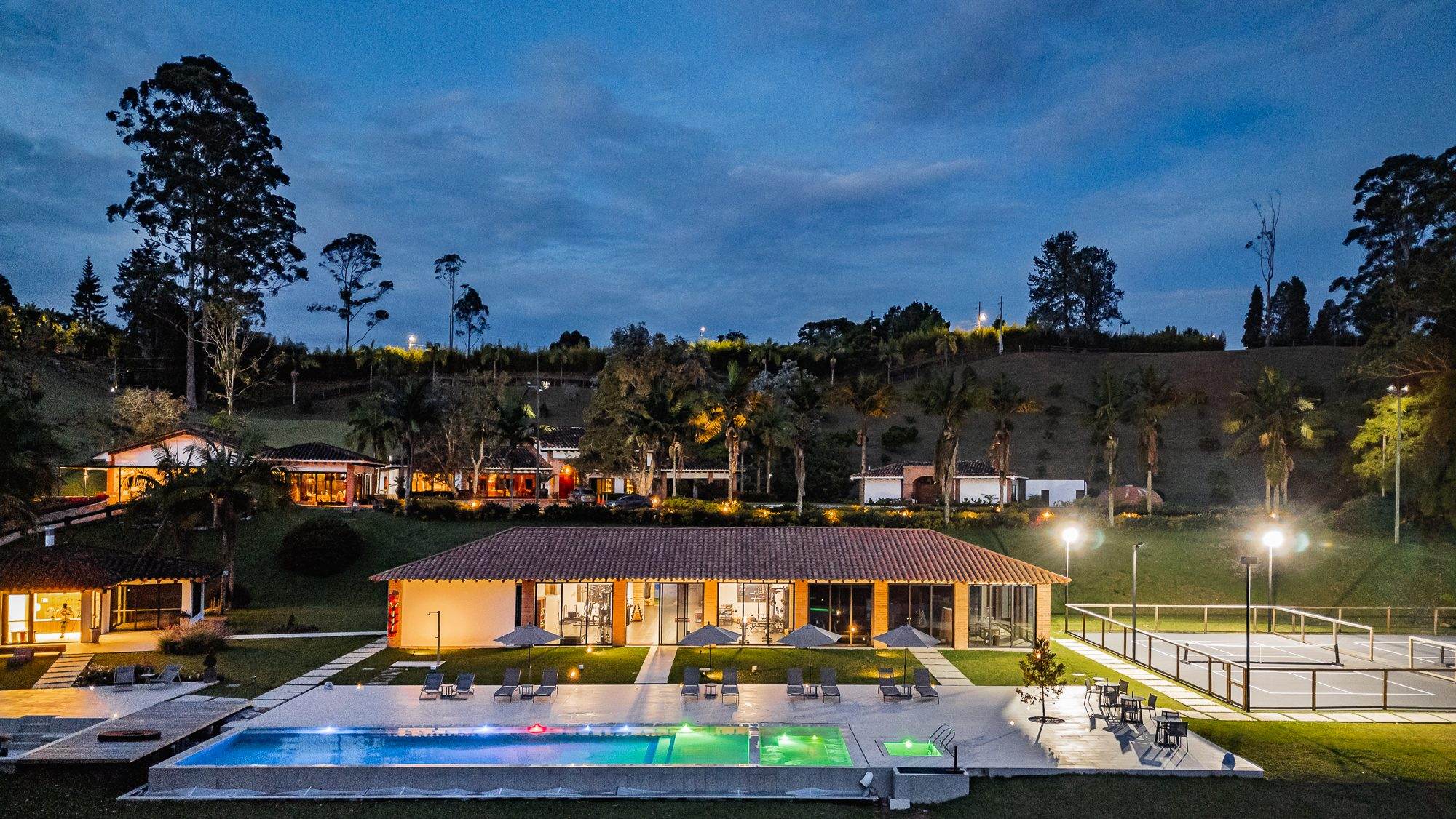 The main house and pool at Mountains of Hope at blue hour.