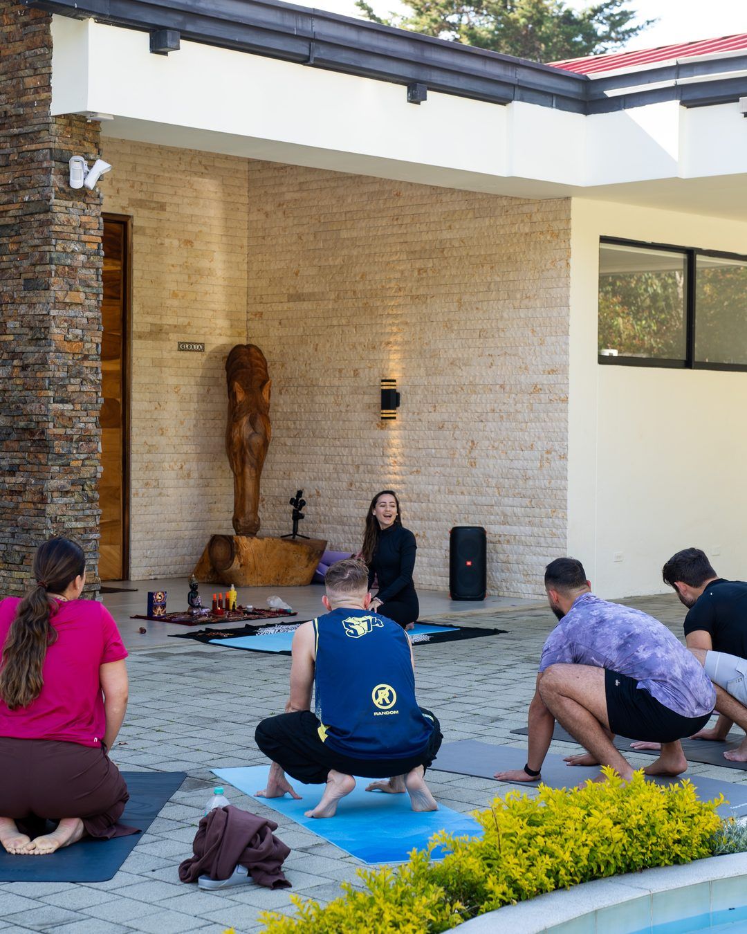 Founders Reset attendees in a workshop circle on the patio.