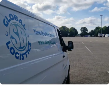 SB Global Logistics van at an outdoor event site for loading and handling
