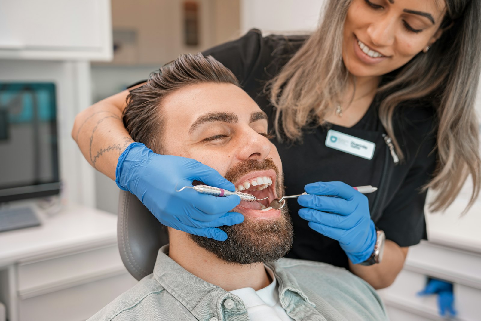 Dentist examining a patient's teeth in a modern dental clinic