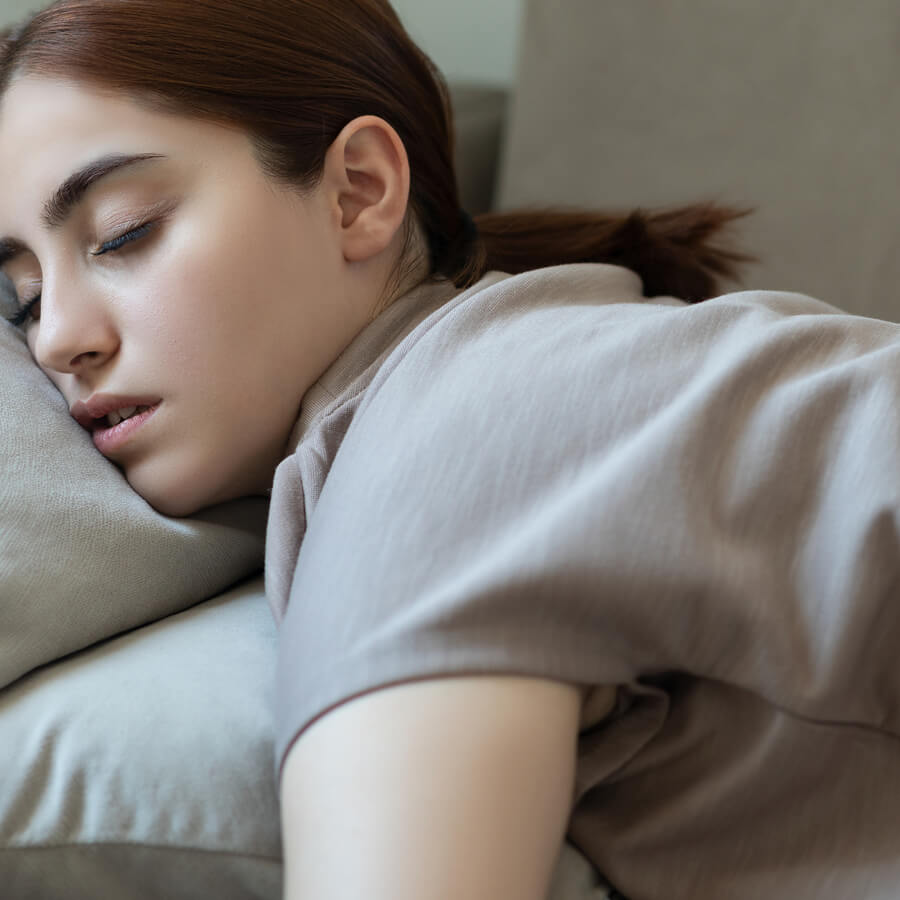 Young woman passed out on the couch