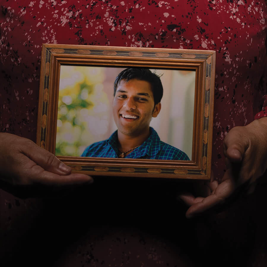 Close up of a framed photo of a young man