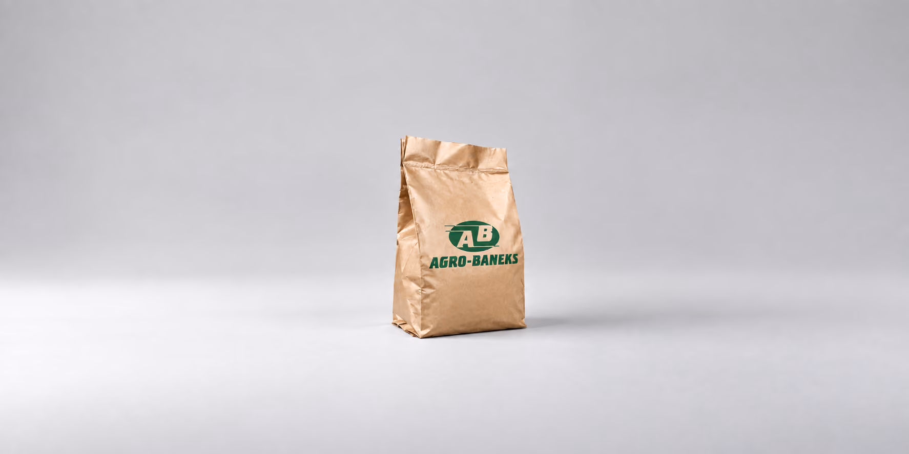 Brown paper bag with green logo and text reading 'A-B AGRO-BANEKS' on a light gray background.