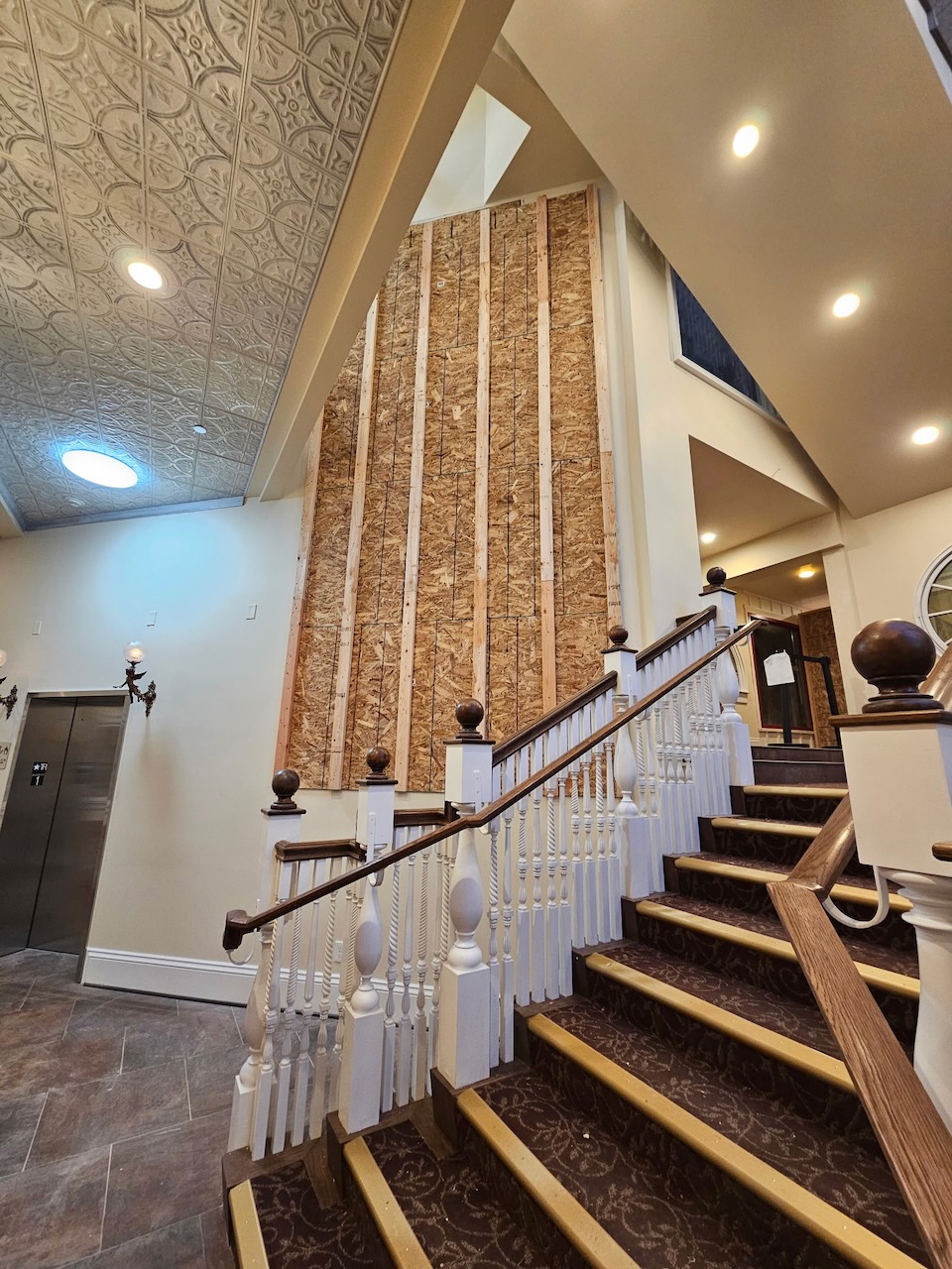 Bare studded wall in the Stanley Chocolate Factory foyer before the LED wall was installed